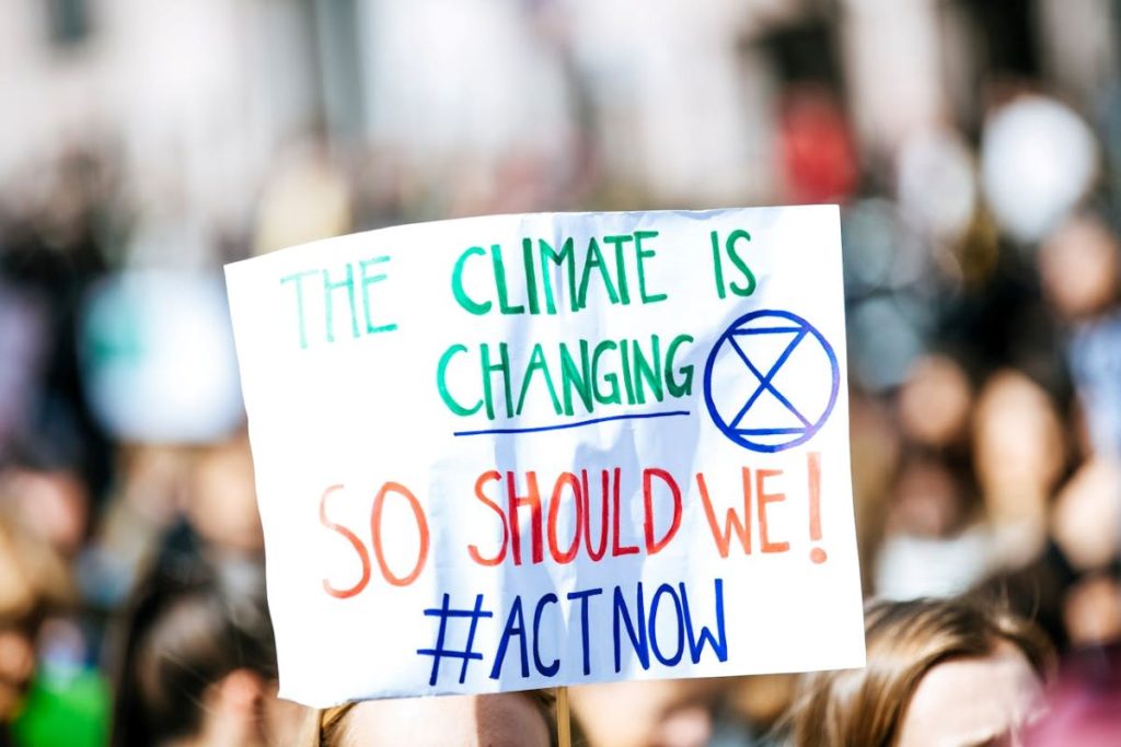 signage of climate change social issues in the world