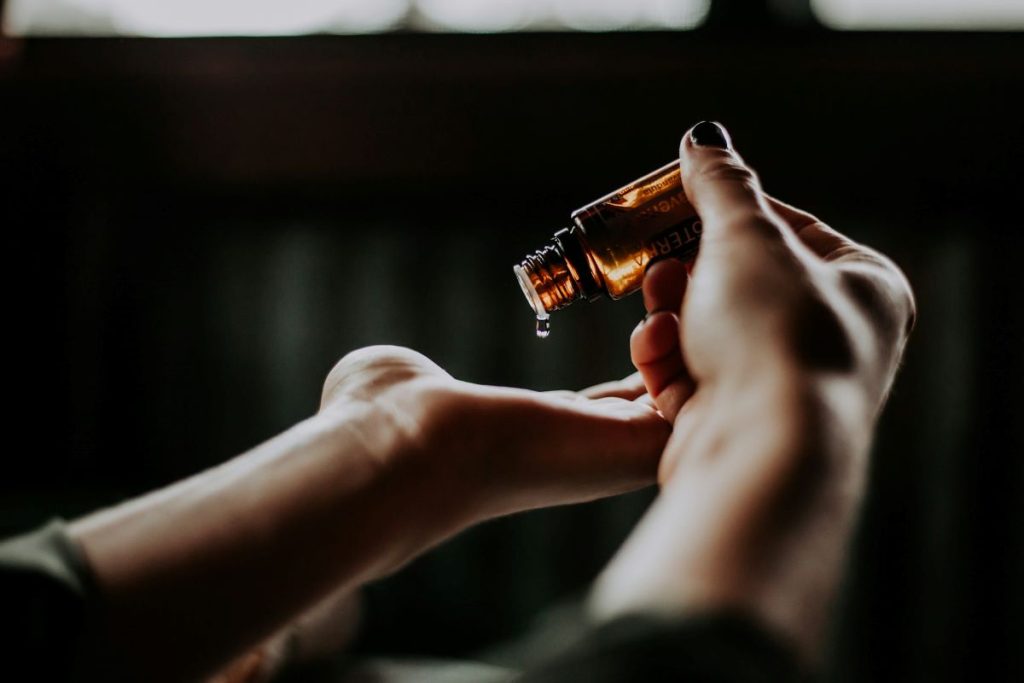 hands of pouring soothing oil after helping parents cope with a child's diagnosis