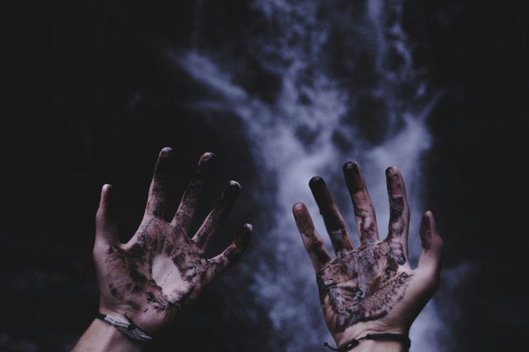 The hands of tortured poets stained with black ink.