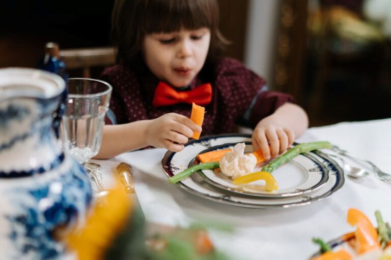 child eating their vegetables after parent used some tips to encourage kids to eat vegetables