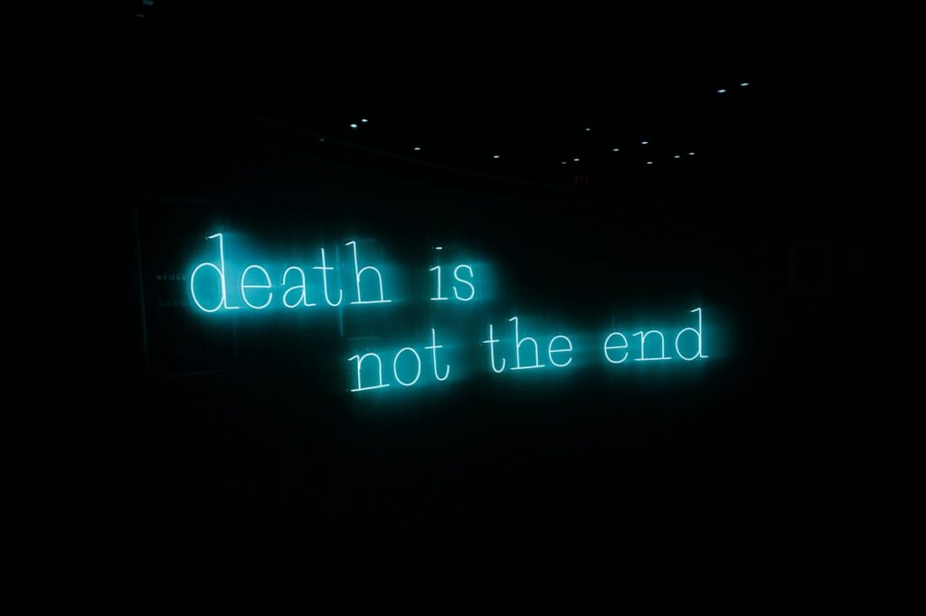 a photo of the lit words "death is not the end" 