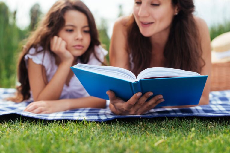 a photo of a mother reading a book to inspire young readers