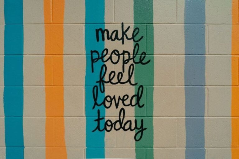 a wall painted with make people feel loved today