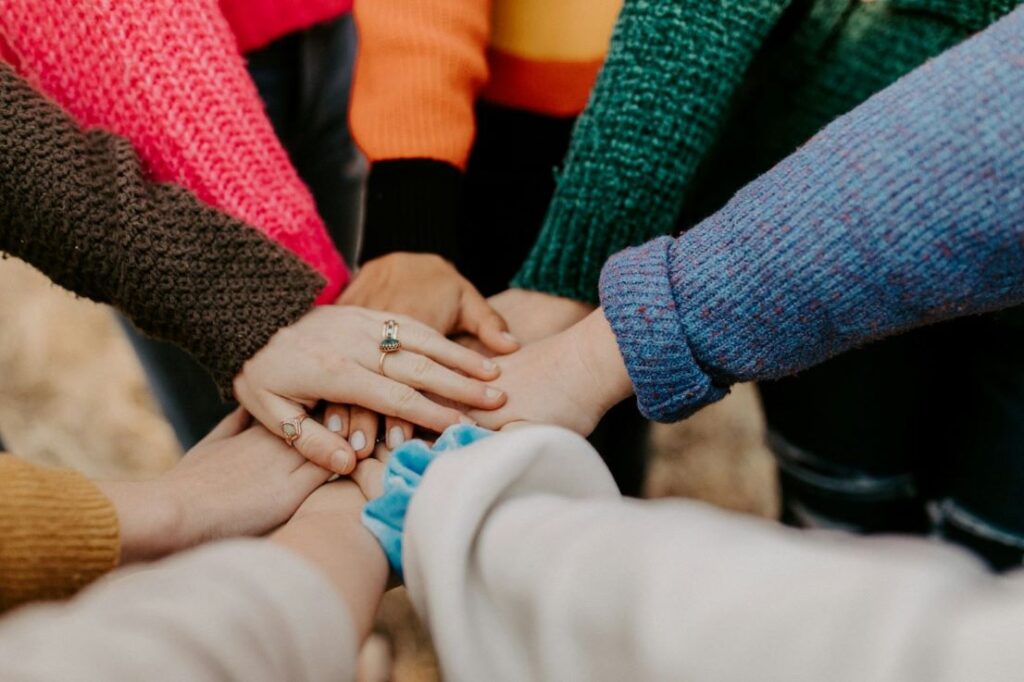 Hands huddled together.