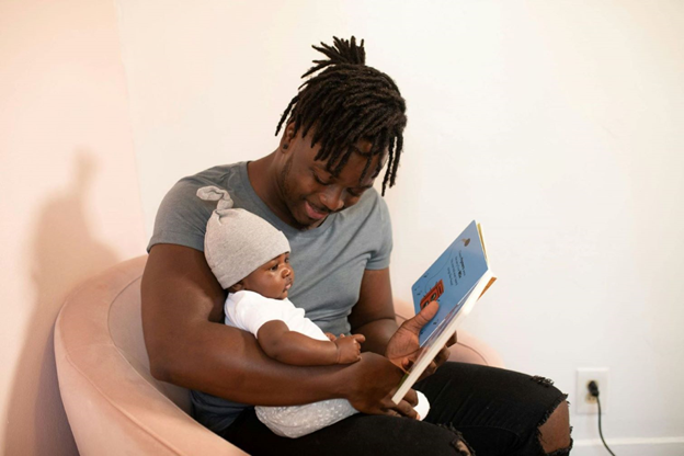 A father reading to his child.