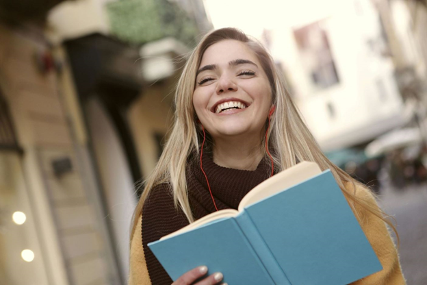 A happy woman with a book