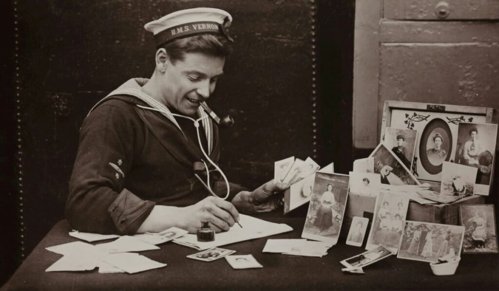 a grayscale photo of a man engaging in love letter writing