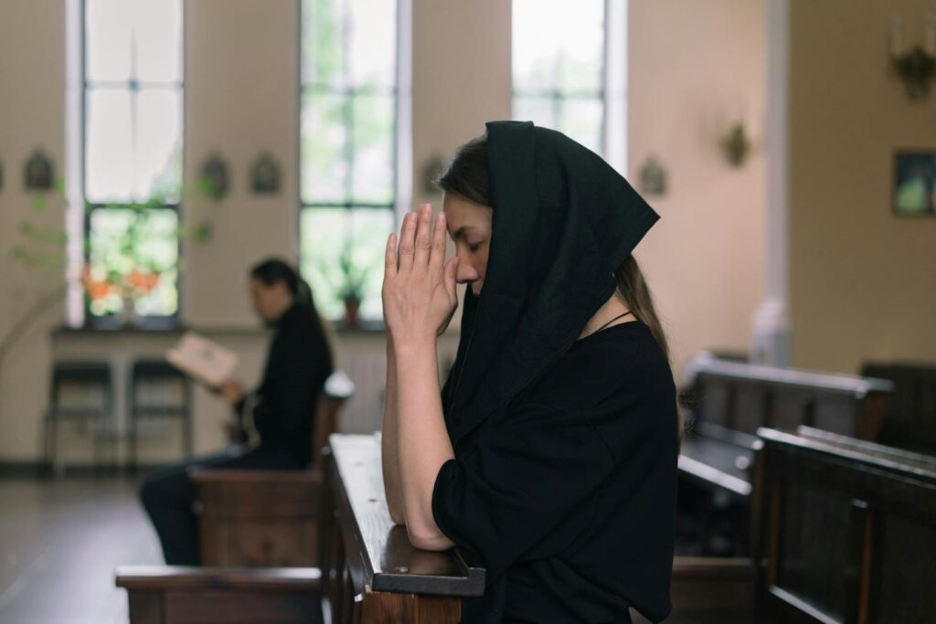 A young woman in prayer.