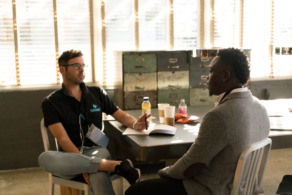 image of two people discussing mental health treatments for patients