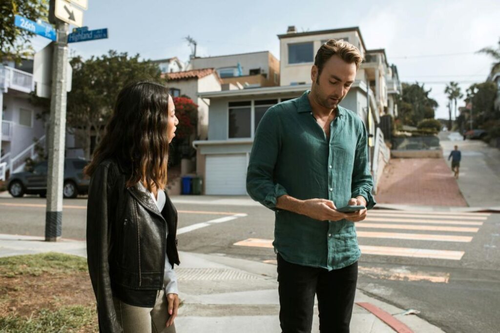 A couple arguing on the street.