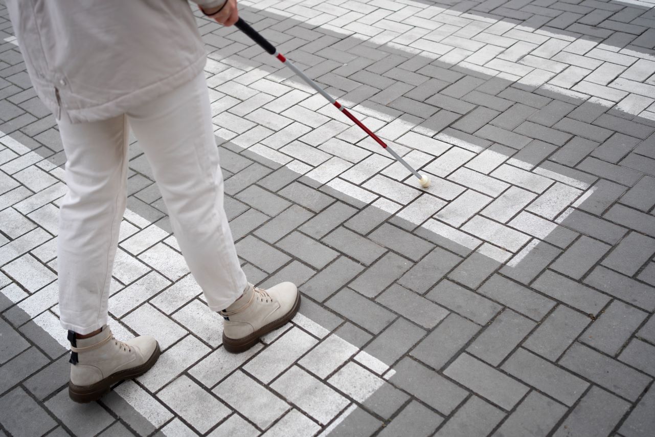 a photo of a blind person coping with vision loss