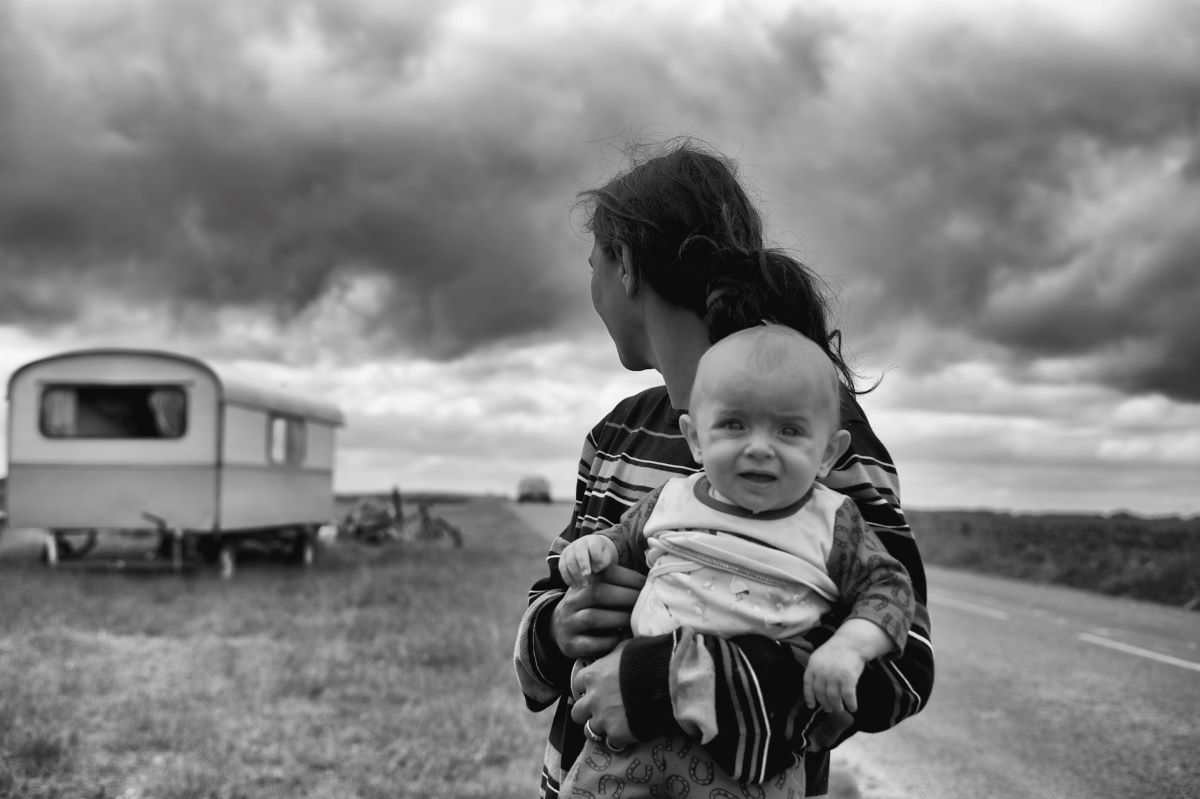 image of a woman carrying a baby with a worried face is the beginning of books about surviving childhood sexual abuse