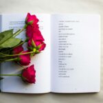 image of poetry book with flower on top its pages showing one of the inspirational poetry books to read