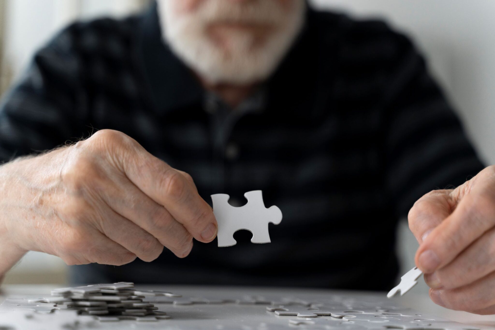 a photo of an old man playing activities for brain health