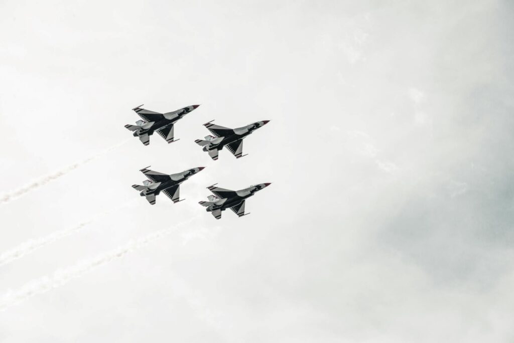 Four jet fighters flying.