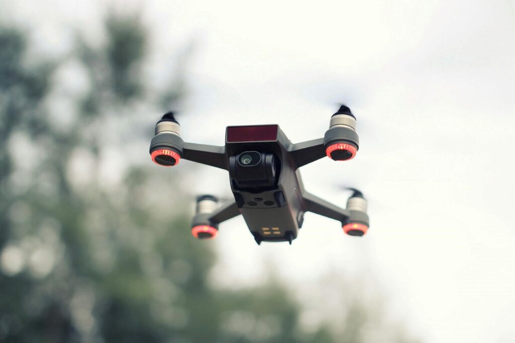 A drone flying with a camera attached.