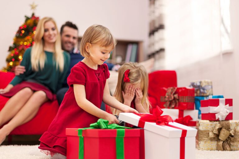 a photo of children unwrapping their gifts happily which reflects why parents should choose the right storybook to give