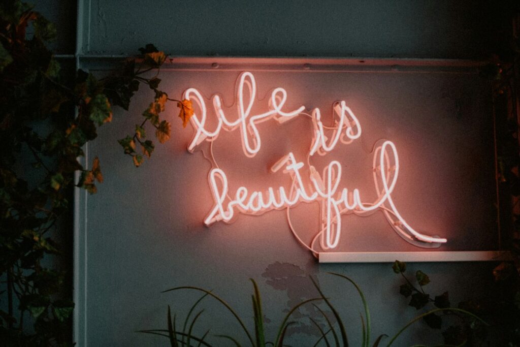 a lit signage of the phrase “life is beautiful”