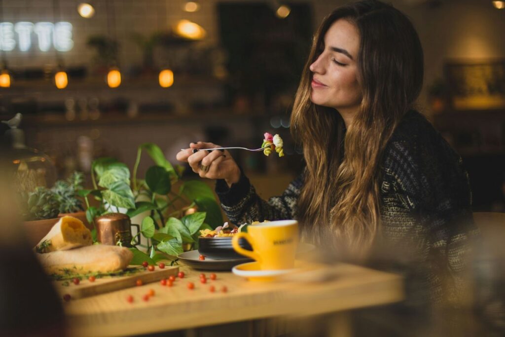 a person eating, being happy and healthy with food