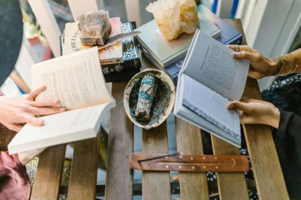 A pair of women reading books.