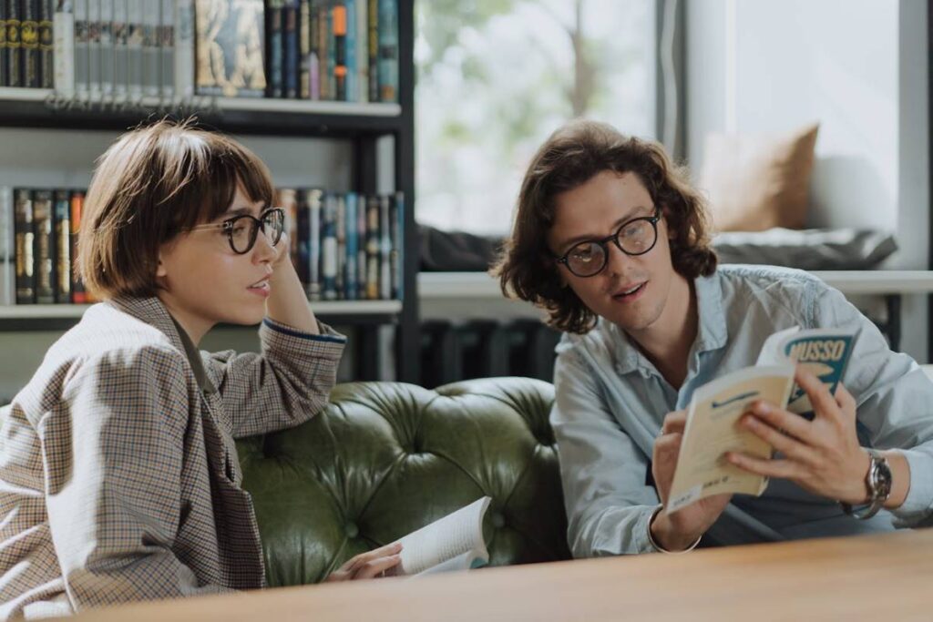 a man and woman talking about the book