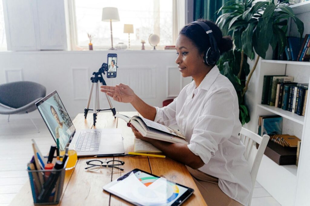 Woman doing a book launch online, depicting virtual author meet and greet | Photo by Antoni Shkraba