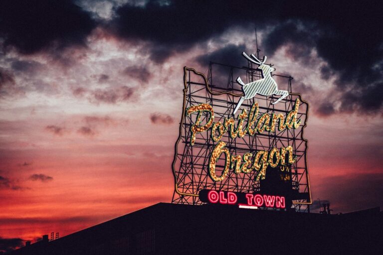 a photo of a Portland Oregon sign which is a place in one of the books set in oregon